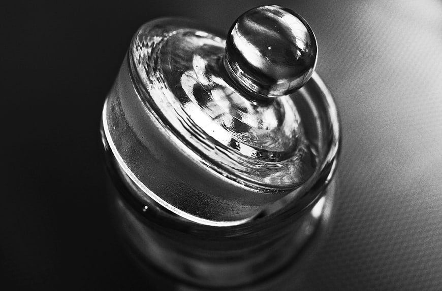 Close-up of vintage glass bottle stopper in black and white