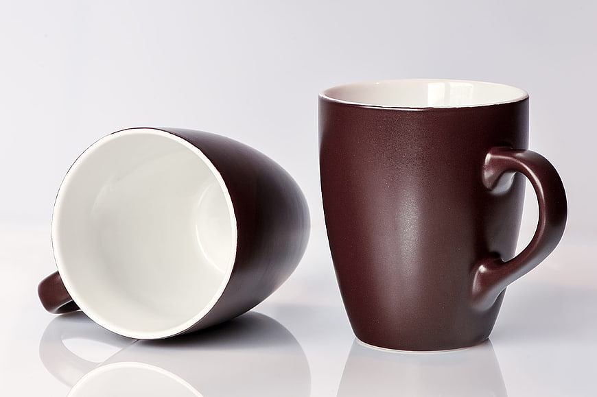 Two Brown Ceramic Coffee Mugs Isolated on White Background