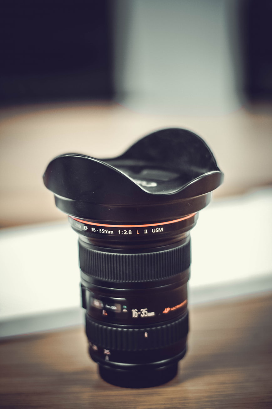 Professional Camera Lens on Wooden Table