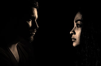 Dramatic Sepia Portrait of Man and Woman Facing Each Other