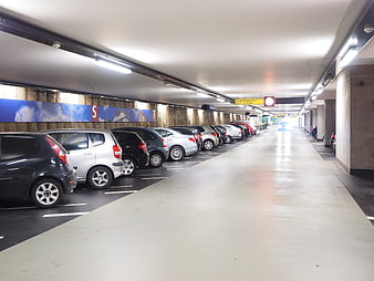 Interior View of Multi-Storey Parking Garage with Parked Cars