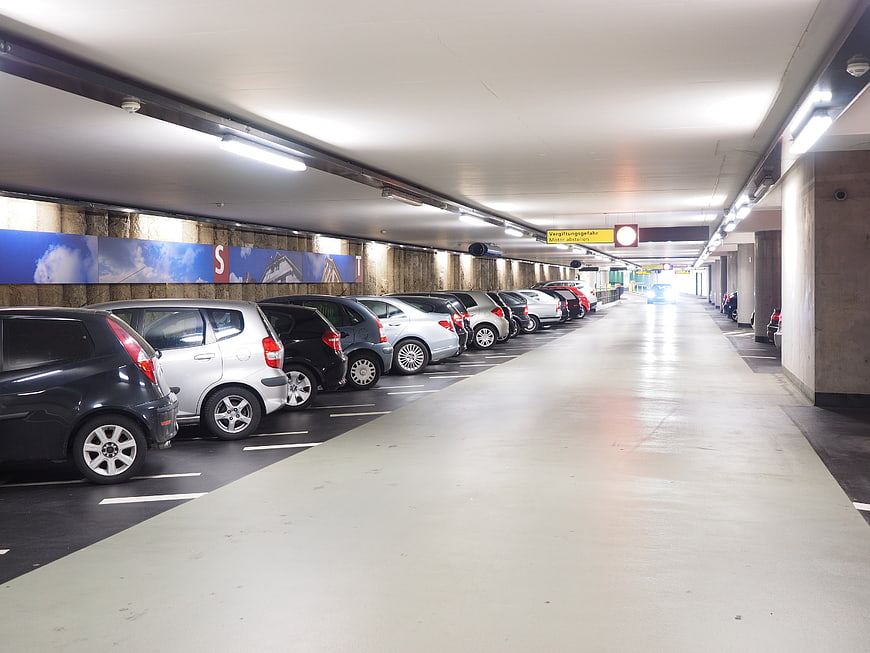 Interior View of Multi-Storey Parking Garage with Parked Cars