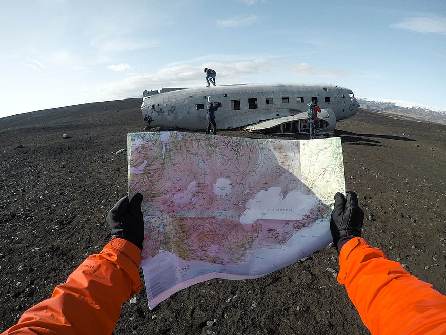 First-person view holding map at Solheimasandur plane wreck