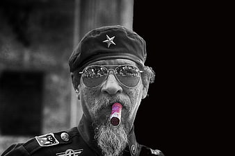 Black and White Portrait of Elderly Man with Cigar and Military Cap