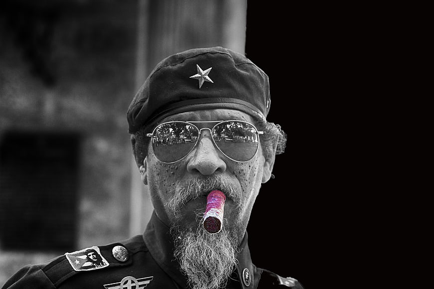 Black and White Portrait of Elderly Man with Cigar and Military Cap