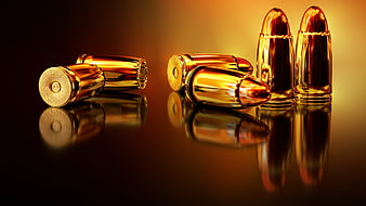 Golden Bullet Cartridges on Reflective Surface
