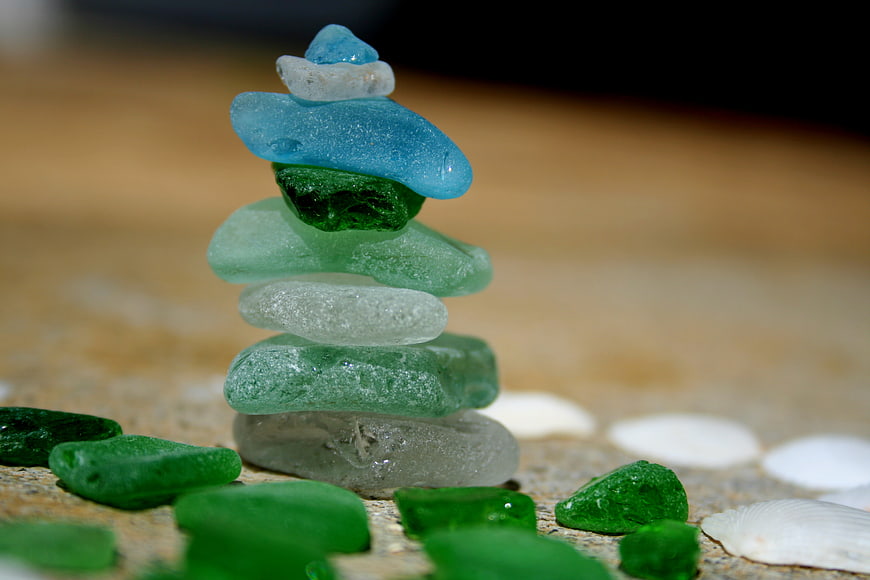 Stacked Sea Glass Stones on Beach with Shells