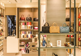 Interior of a luxury fashion boutique with handbags and shoes