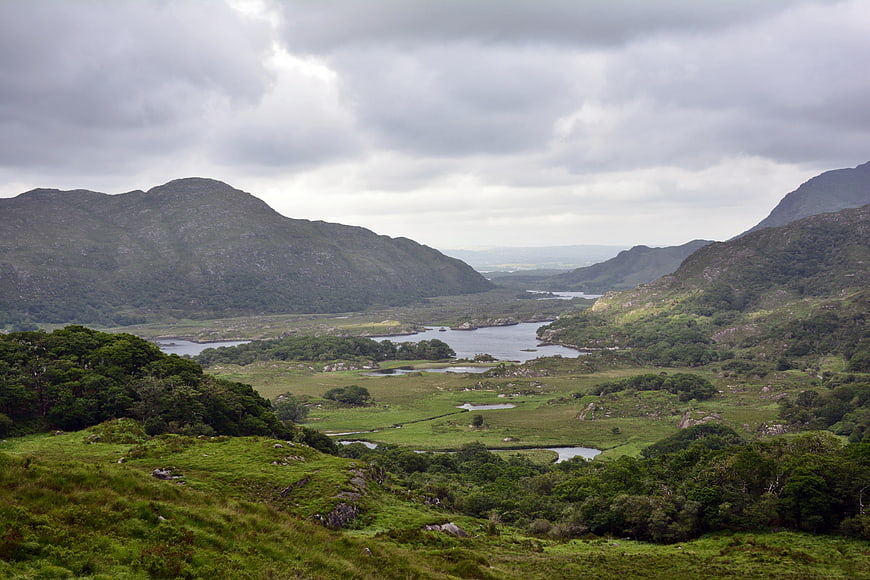Scenic Green Valley Landscape With Lakes And Mountains In Ireland
