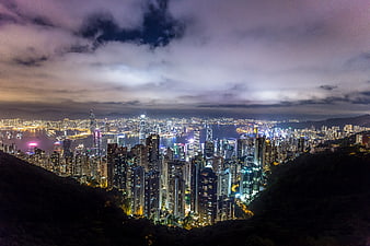 Hong Kong Cityscape at Night with Dramatic Clouds and Skyscrapers