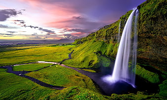 Sealifoss Waterfall in Iceland at Sunset with Vibrant Sky