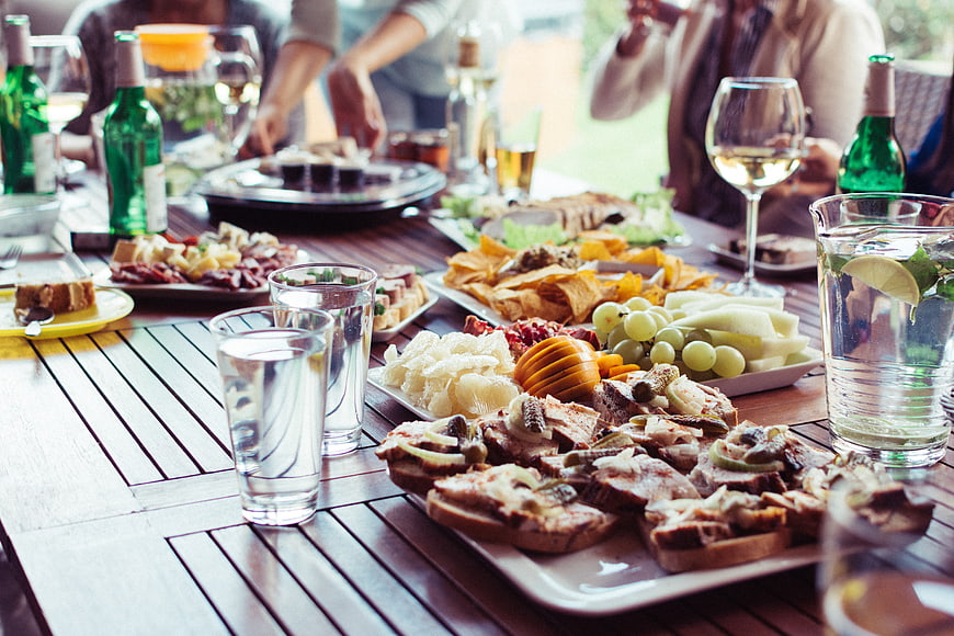 Summer garden party table with appetizers and drinks