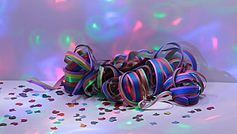 Colorful party streamers and confetti with disco lights