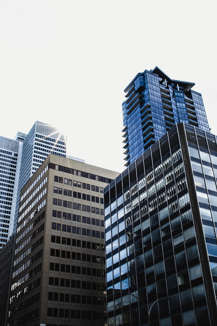 Low angle view of modern glass skyscrapers in downtown city