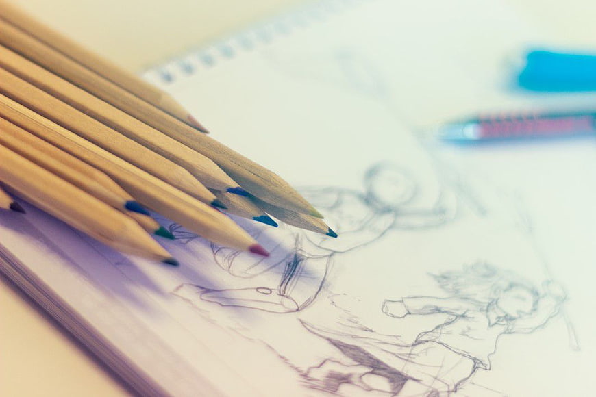 Colored Pencils on Sketchbook with Anime Drawings