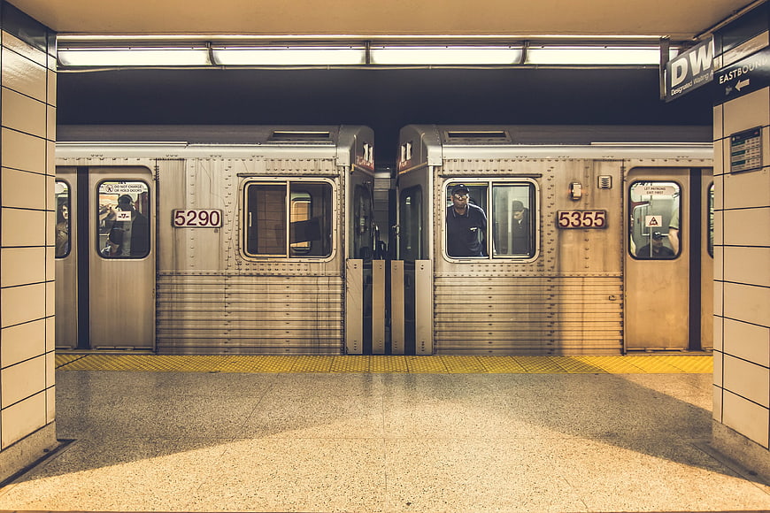 Two subway trains coupled at a station platform