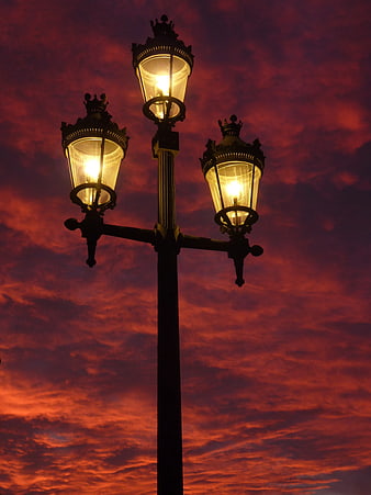 Vintage Street Lamp Against Dramatic Red Sunset Sky