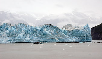 Massive Blue Glacier Face in Glacial Lake