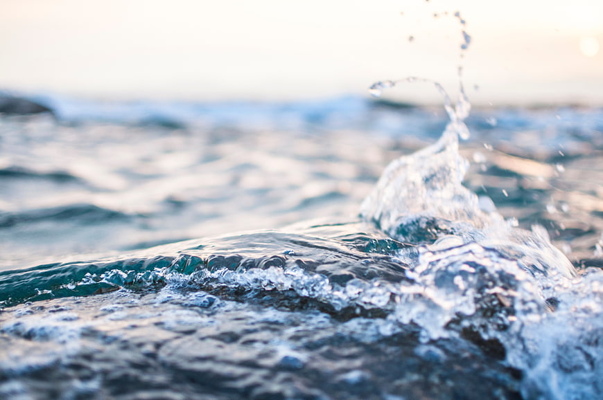 Close-up of ocean wave splash with blurred background