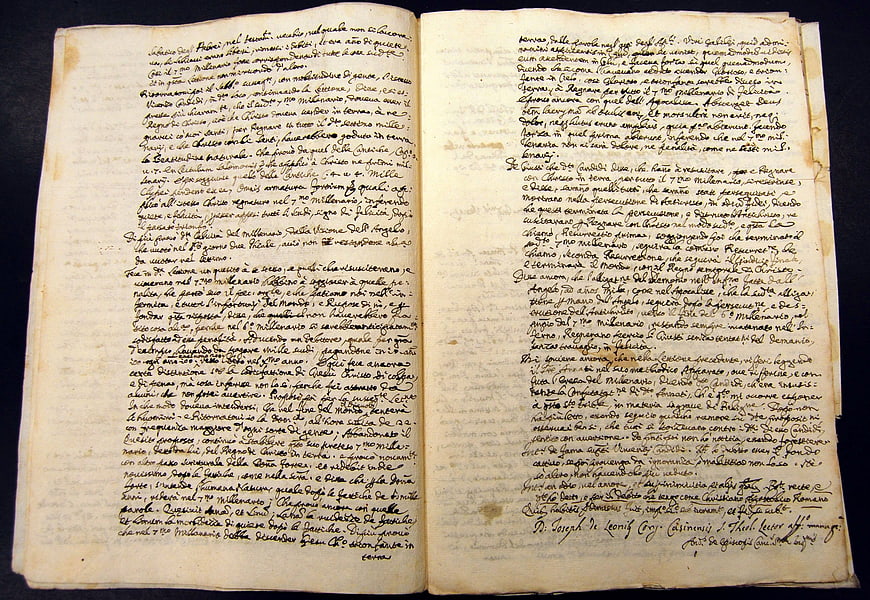 Open Pages of Ancient Italian Manuscript with Cursive Ink Writing