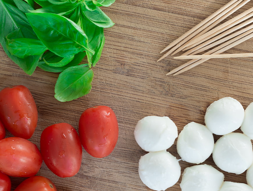 Fresh Caprese Salad Ingredients on Wooden Board