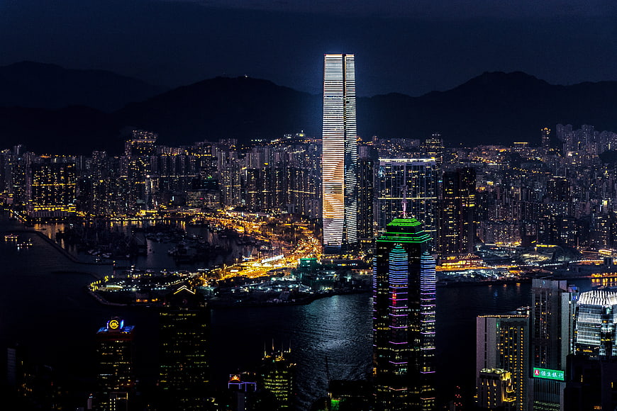 Hong Kong Night Skyline Panoramic View with Illuminated Skyscrapers