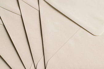 Minimalist Beige Envelopes Arranged in Diagonal Pattern