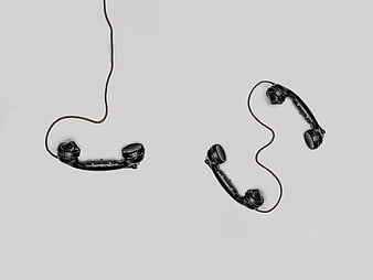 Vintage Black Telephone Handsets on White Background
