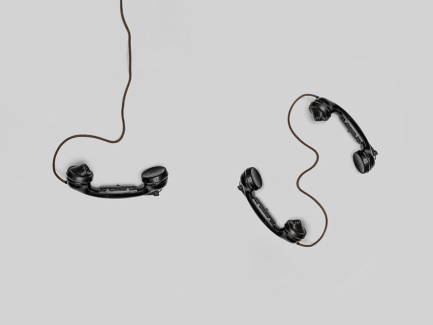 Vintage Black Telephone Handsets on White Background