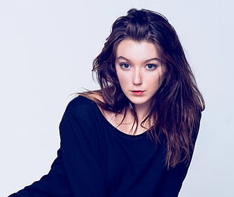 Portrait of Young Woman with Blue Eyes and Messy Hair