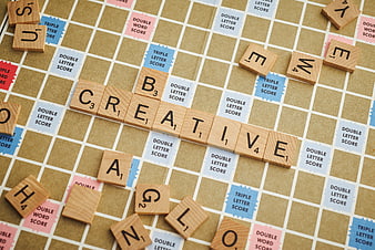 Creative Word Spelled on Scrabble Board