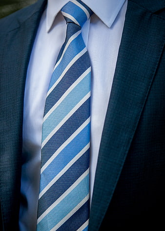 Close-up of blue striped tie and suit jacket