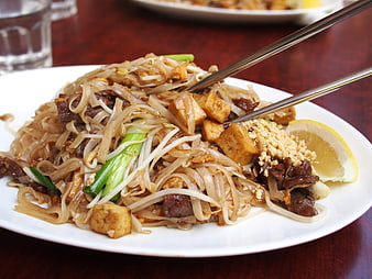 Close-up of Pad Thai with Beef and Tofu on White Plate