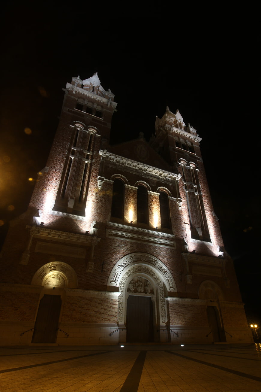 Illuminated Brick Church Architecture at Night