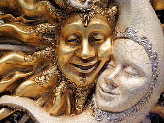 Close-up of ornate gold and white Venetian carnival masks