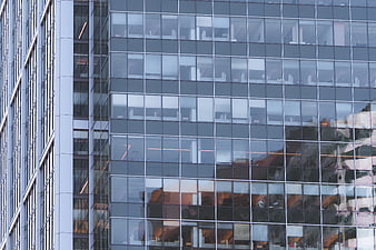Modern Glass Office Building Facade with Reflections