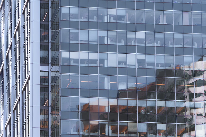 Modern Glass Office Building Facade with Reflections