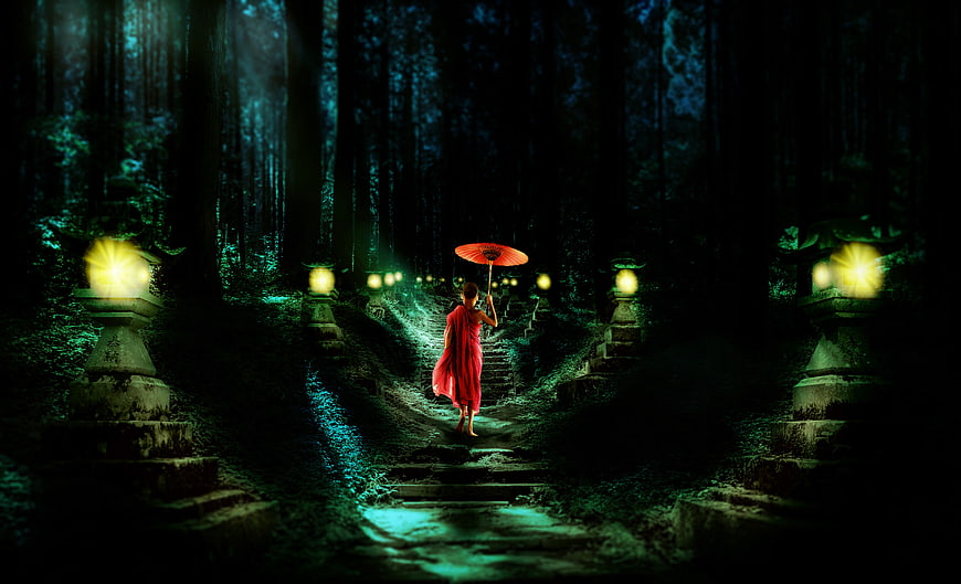 Mystical Buddhist Monk Walking Forest Path With Red Umbrella
