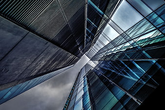 Low angle view of modern glass skyscrapers and urban architecture