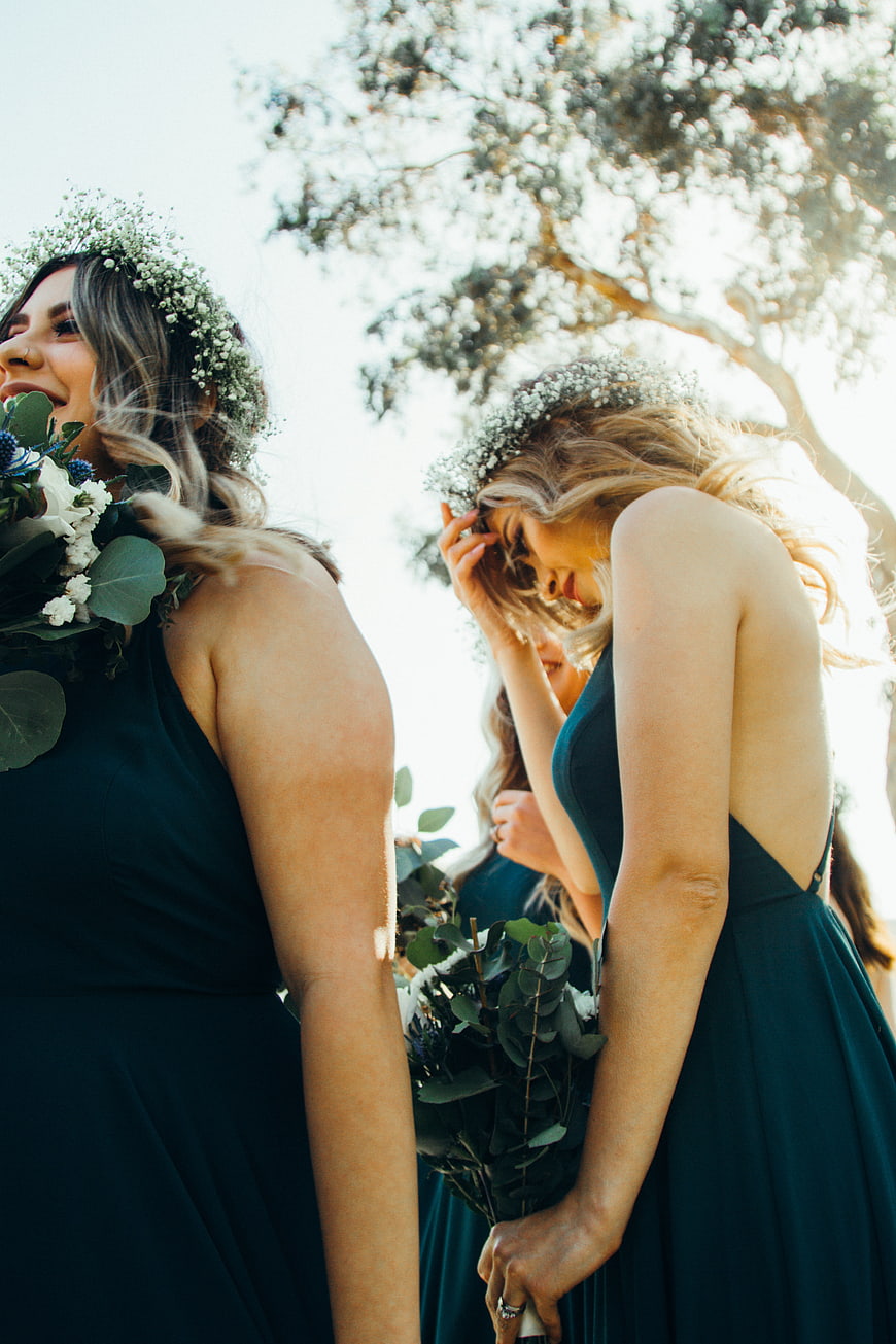 Bridesmaids in Teal Dresses with Floral Crowns Outdoors