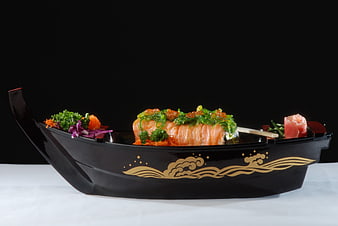 Gourmet Salmon Sushi Served in Decorative Black Boat Dish