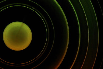 Abstract Green and Orange Concentric Circles on Black Background