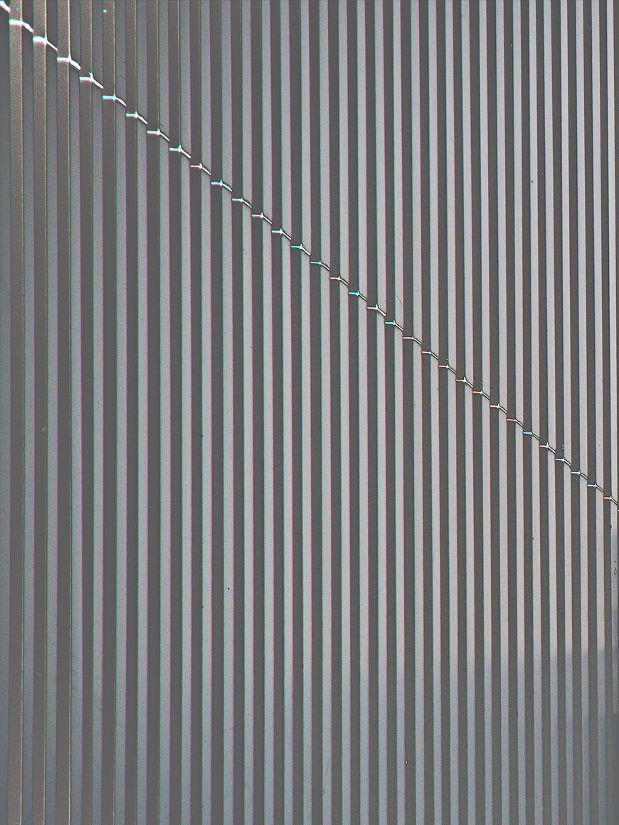 Abstract Vertical Metal Wall Texture with Diagonal Seam