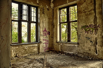 Abandoned Room Interior With Graffiti and Peeling Walls