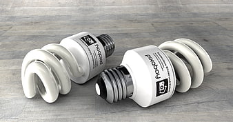 3D Render of Two Spiral CFL Light Bulbs on Wood