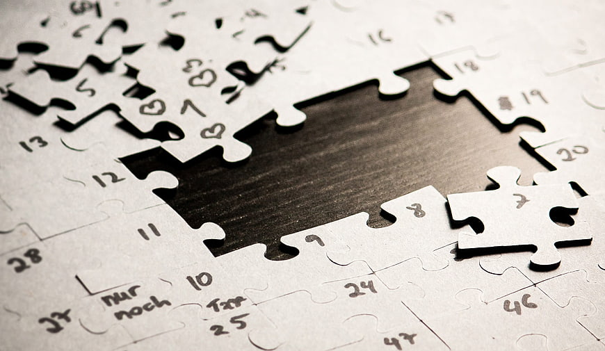 Missing puzzle piece on calendar with hearts and numbers
