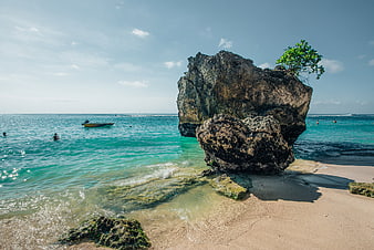 Large Rock Formation on Bali Beach with Turquoise Water
