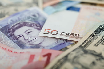 Close-up of mixed international currency banknotes