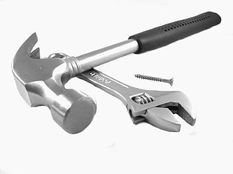 Black and White Studio Shot of Hammer, Wrench, and Screw
