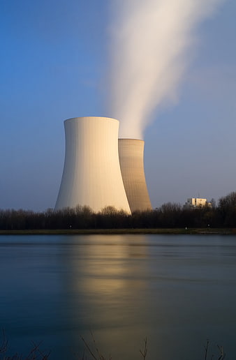 Nuclear Power Plant Cooling Towers Reflected in River at Dusk
